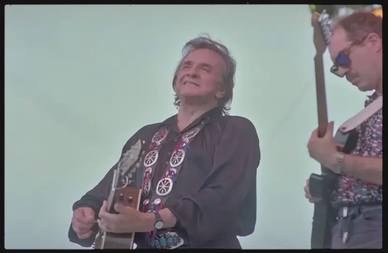 Today's epic earworm is from Johnny Cash, pictured here performing at Fan Fair held at the State Fairgrounds in Nashville, Tennessee in 1993.