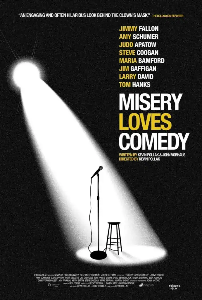 Misery Loves Comedy poster that has a spotlight, a microphone, and a stool on stage.