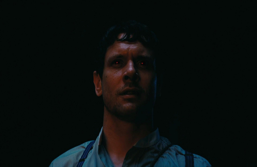 Jack O'Connell in Sinners (2025) with red glowing eyes