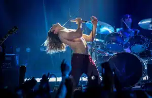 Rocker Vampire Lestat on stage performing.