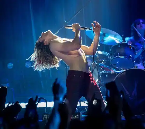 Rocker Vampire Lestat on stage performing.