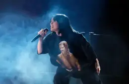 Apr 3, 2022; Las Vegas, NV, USA; Finneas (l) and Billie Eilish perform Happier Than Ever during the 64th Annual Grammy Awards at the MGM Grand Garden Arena in Las Vegas. EIlish is wearing a shirt featuring an image of Foo Fighters drummer Taylor Hawkins. Mandatory Credit: Robert Hanashiro-USA TODAY. Eilish will work with James Cameron on her next 3D project.