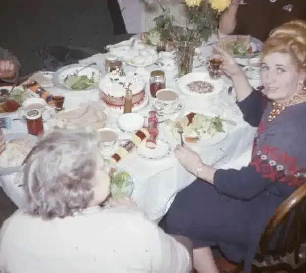 A family eating Christmas dinner, 1965. 35mm film slide image, family tension