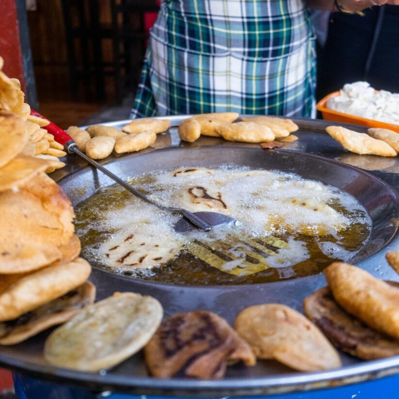 Close-up of traditional Native American recipes like fry bread being cooked in Puebla, Mexico.