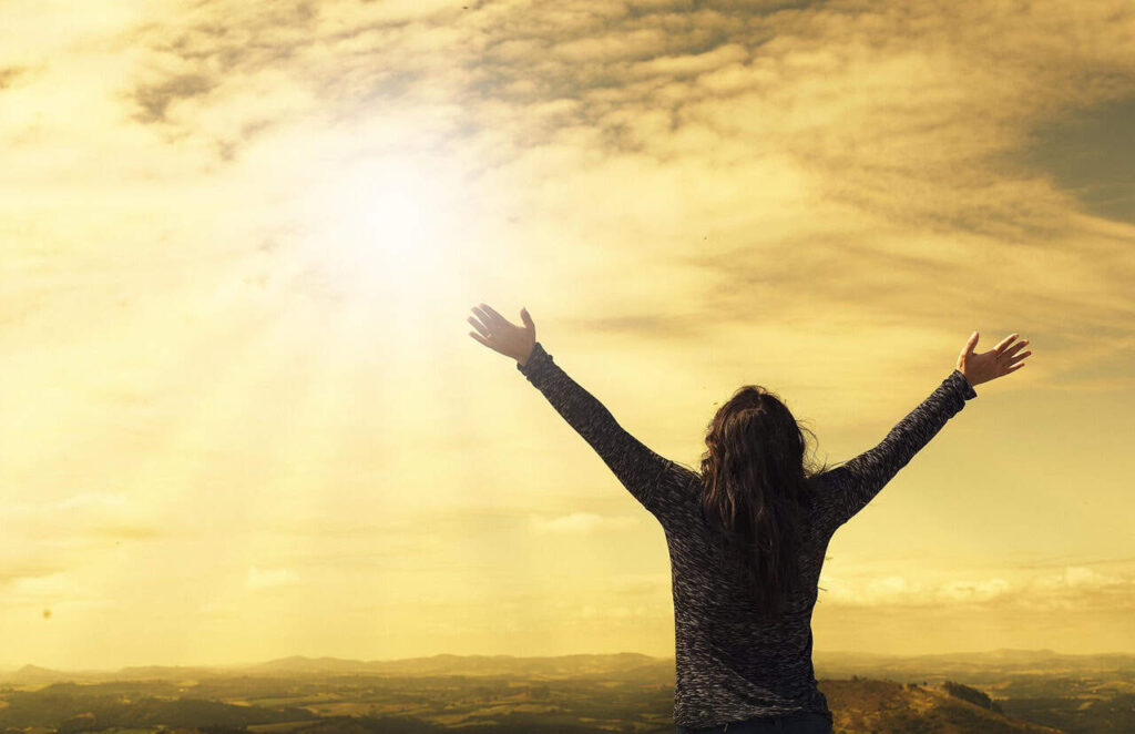 woman, sky, nature, sunlight, arms, open arms, sunbeams, sunrays, clouds, worship, freedom, happiness, relieved, prayer, praise, success, joy, daily devotion