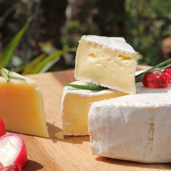 This is a photograph of a cheese display. A cheese board can be a convenient and enticing option for fall guests.