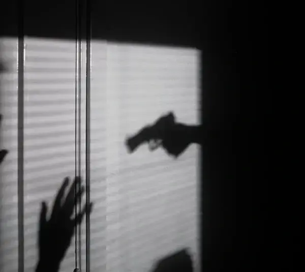 silhouette of person held at gunpoint / Girlalala