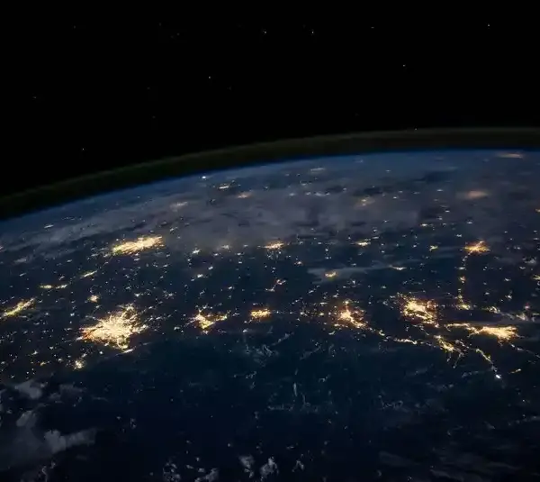 Image of part of the Earth from space showing the lights of cities below
