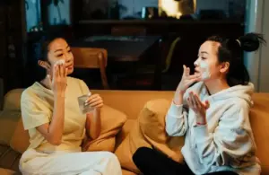 Two women trying K-beauty and beauty trends