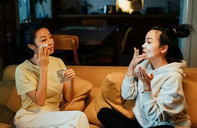 Two women trying K-beauty and beauty trends