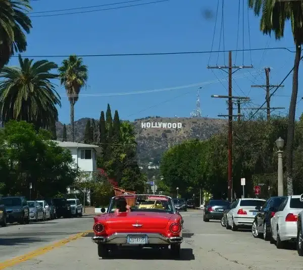Red car traveling in Hollywood, where AFM is located.