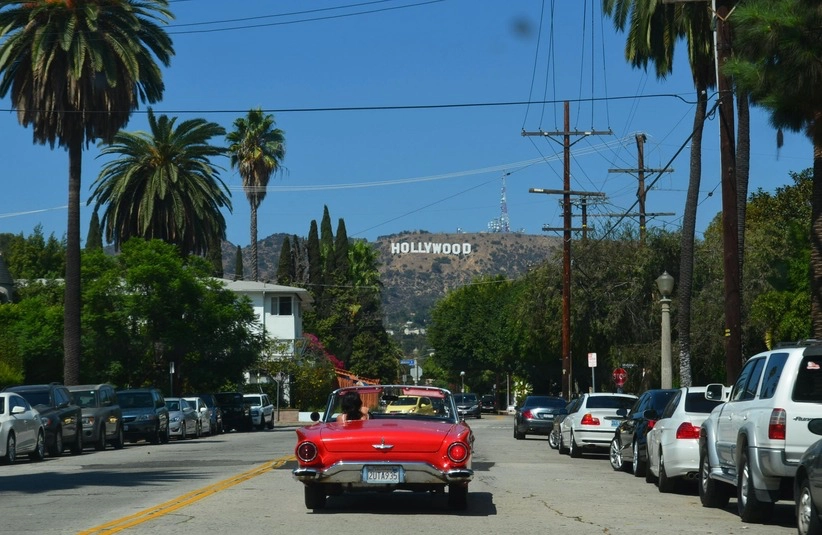 Red car traveling in Hollywood, where AFM is located.