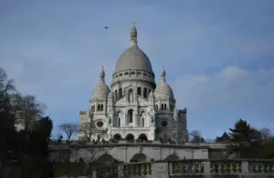 SacreCoeur Basilica in Paris on a clear day. Saint Theophane Vernard was a French Missionary.
