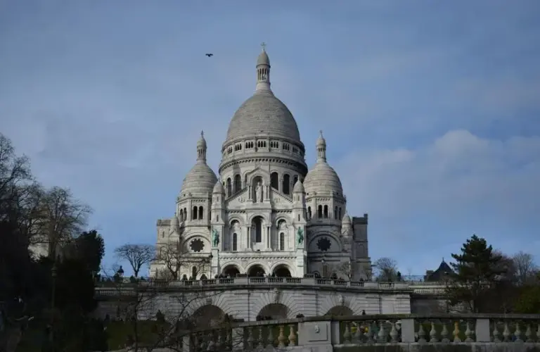 SacreCoeur Basilica in Paris on a clear day. Saint Theophane Vernard was a French Missionary.