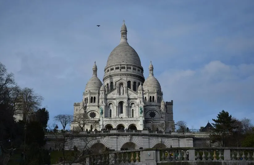 SacreCoeur Basilica in Paris on a clear day. Saint Theophane Vernard was a French Missionary.