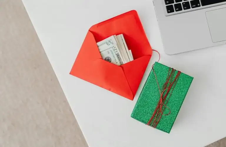 holiday budget, money in an envelope, holiday theme, budgeting for the holidays