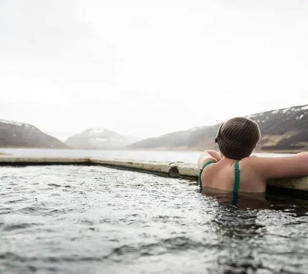 Hot springs being enjoyed during winter travel.