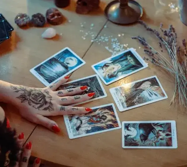 Assorted Tarot cards on a table that could be used to help determine your birth card.