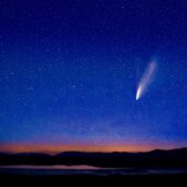 Dramatic view of a comet streaking across a starry night sky over Montana landscape. The top of Expedia's destinations of the year.