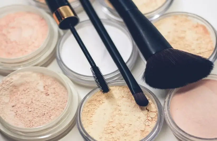 Makeup brushes on top of powders, Native American beauty brands