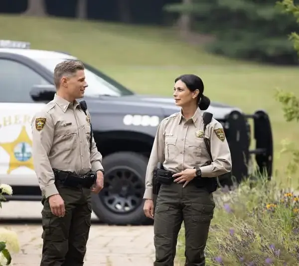 Morena Baccarin and Matt Lauria in Sheriff Country (2025). Sheriff Country is one show from CBS that has been renewed.