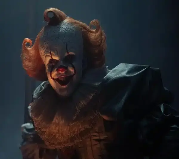 Pennywise from IT: Welcome to Derry, giving an evil smile.