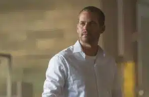 Paul Walker in Furious 7 (2015) in a white button-up shirt.