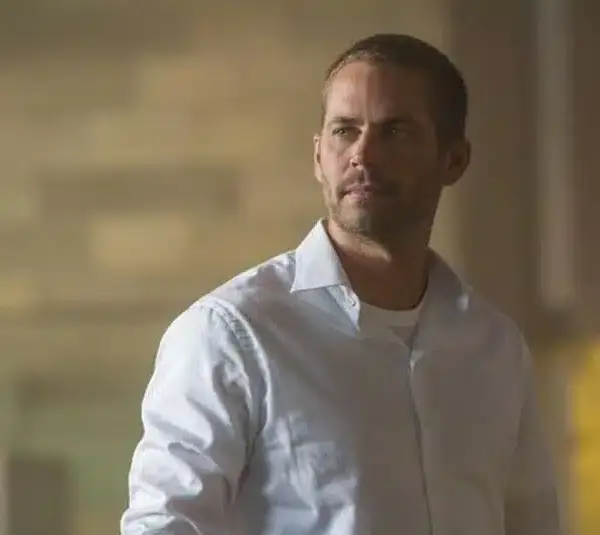 Paul Walker in Furious 7 (2015) in a white button-up shirt.