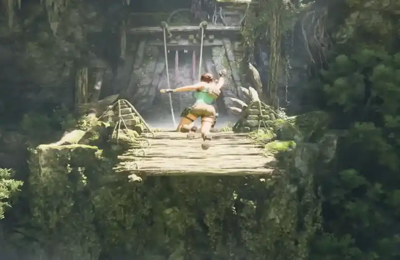 Laura Croft jumping over a large gap to a new platform with remade graphics and controls.
