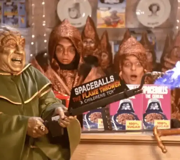 Spaceballs, meta comedy, Star wars parody, Mel Brooks films, first film to the sequel Spaceballs 2, Yogurt selling merchandise for Spaceballs