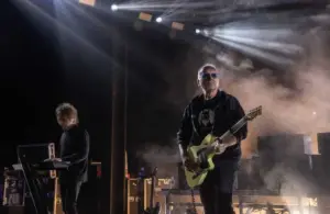 The Cure's Perry Bamonte, left, and Reeves Gabrels perform in front of thousands of people at the Pine Knob Music Theater in Clarkston on Tuesday, June 13, 2023. Perry Bamonte has passed away.