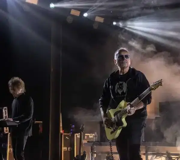 The Cure's Perry Bamonte, left, and Reeves Gabrels perform in front of thousands of people at the Pine Knob Music Theater in Clarkston on Tuesday, June 13, 2023. Perry Bamonte has passed away.