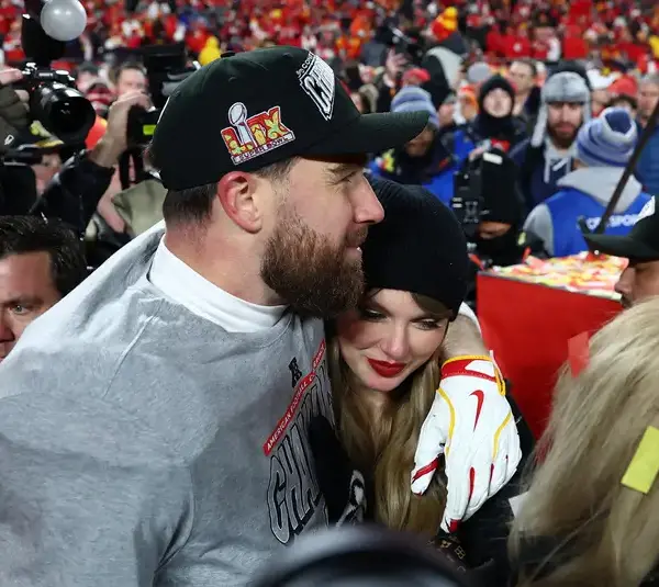 Jan 26, 2025; Kansas City, MO, USA; Recording artist Taylor Swift and Kansas City Chiefs tight end Travis Kelce (87) react after the AFC Championship game against the Buffalo Bills at GEHA Field at Arrowhead Stadium. Mandatory Credit: Mark J. Rebilas-Imagn Images