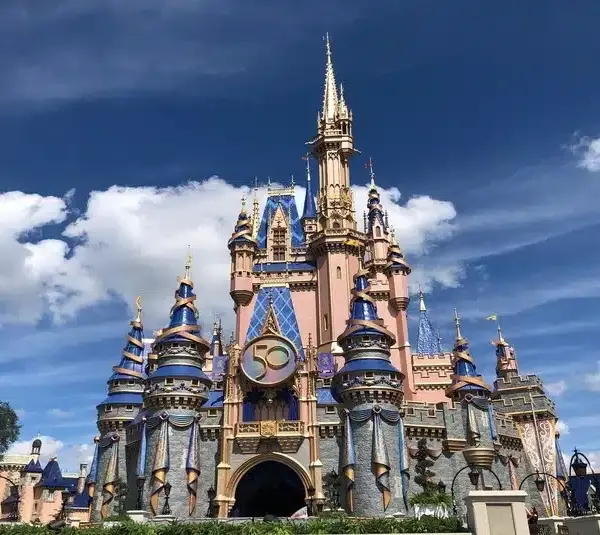 Cinderella Castle had a makeover, with new royal colors and embellishments, as Magic Kingdom turns 50 years old. Guests from around the world are expected for Walt Disney World's 18-month celebration at WDW's four parks.