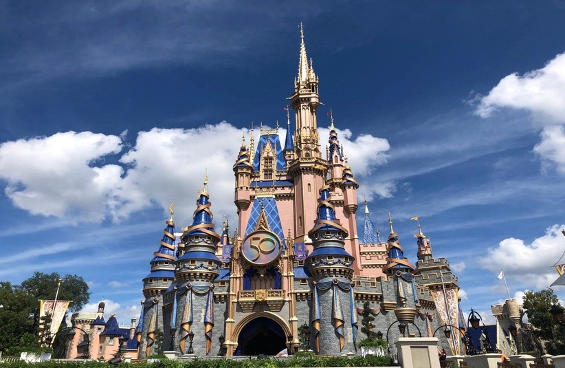 Cinderella Castle had a makeover, with new royal colors and embellishments, as Magic Kingdom turns 50 years old. Guests from around the world are expected for Walt Disney World's 18-month celebration at WDW's four parks.