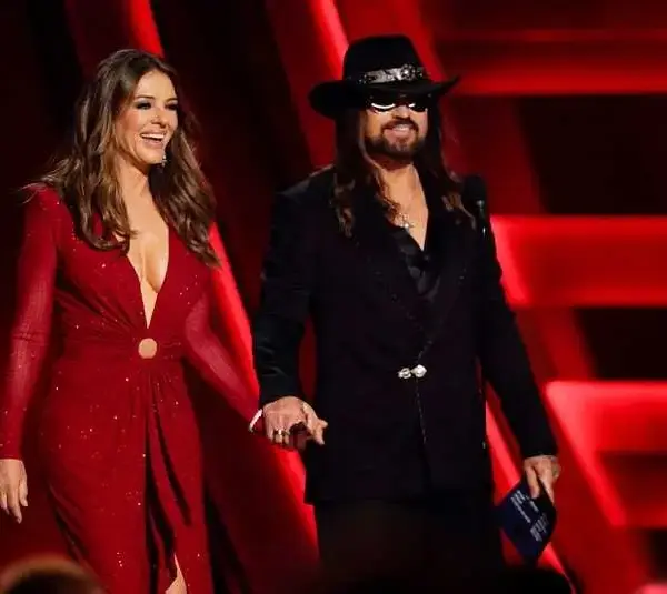 Elizabeth Hurley and Billy Ray Cyrus present during the 59th Annual CMA Awards.