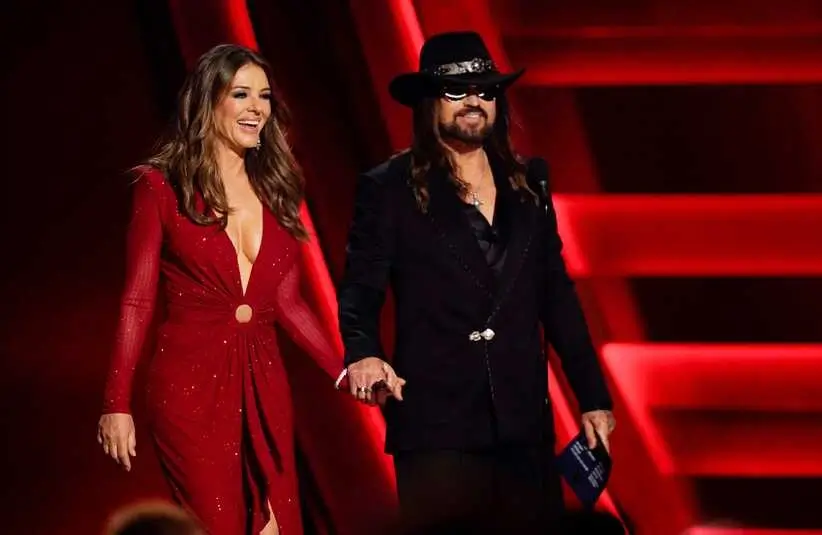 Elizabeth Hurley and Billy Ray Cyrus present during the 59th Annual CMA Awards.