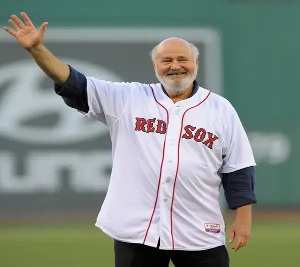 Jun 16, 2014; Boston, MA, USA; American actor Rob Reiner waves to the crowd prior to throwing out the first pitch in a game between the Boston Red Sox and Minnesota Twins at Fenway Park. / Rob and Michele Reiner
