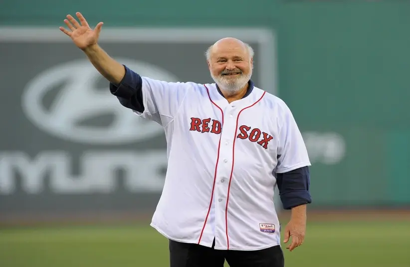 Jun 16, 2014; Boston, MA, USA; American actor Rob Reiner waves to the crowd prior to throwing out the first pitch in a game between the Boston Red Sox and Minnesota Twins at Fenway Park. / Rob and Michele Reiner