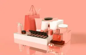 A display of cosmetics with a pink background, beauty products