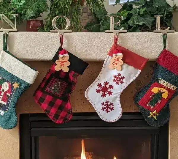 Christmas stockings hung over a fireplace, stocking stuffers