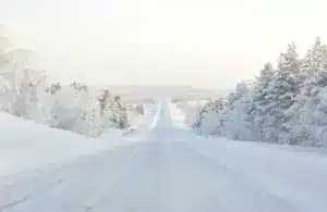 Ice roads in Lapland, road covered in snow, winter travel