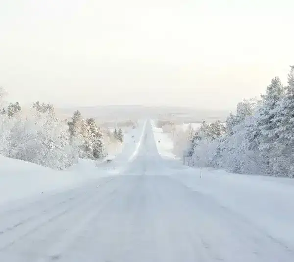Ice roads in Lapland, road covered in snow, winter travel