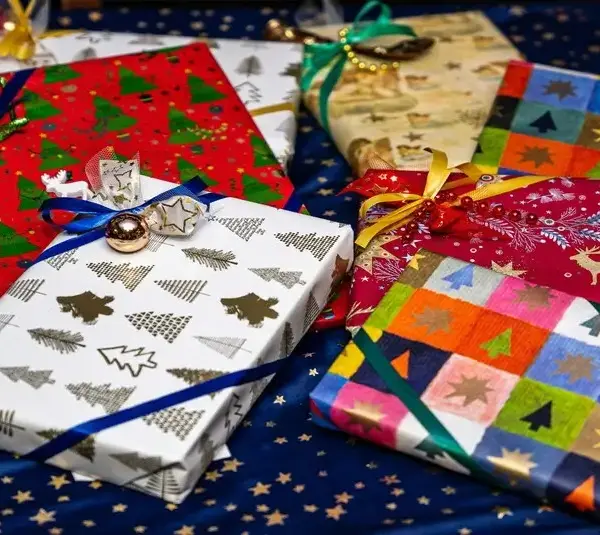 Pile of wrapped Christmas presents, holiday presents, mindful gift giving