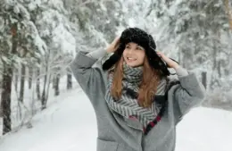 winter fashion trends include long coats and big hats.