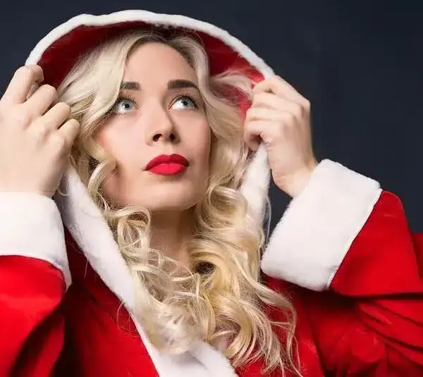 A woman with a curly hair as one of the great holiday hairstyles you can do.