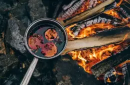 Mulled wine brewing fireside in the winter.