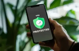 iPhone with VPN service enabled in hand