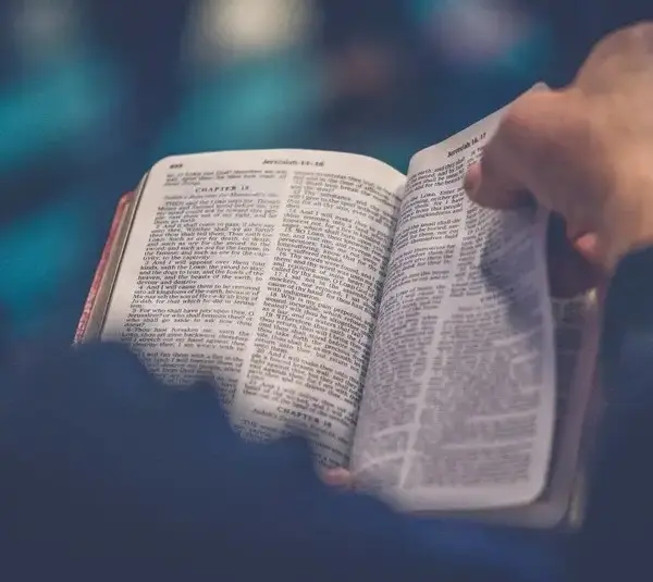 Turning the page of a Bible, Daily Devotion