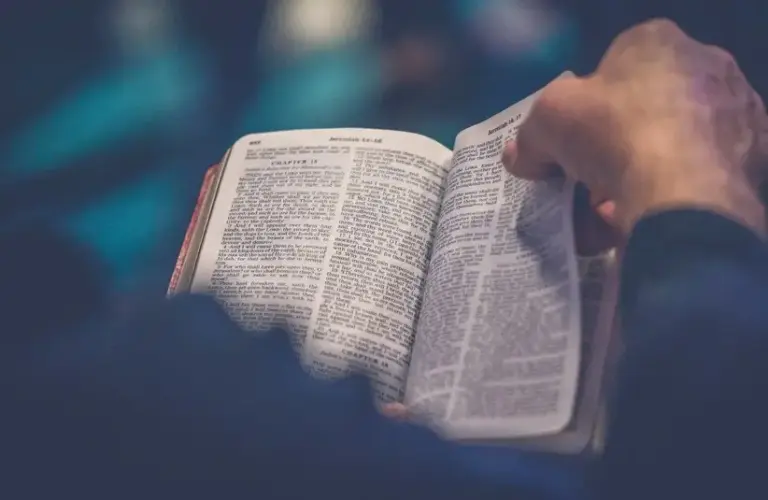 Turning the page of a Bible, Daily Devotion